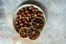 Bowl Of Natural Chestnuts In Shells