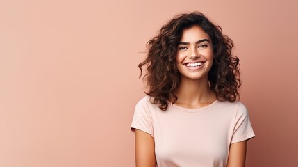 Happy woman posing in studio with solid background ready to take portrait