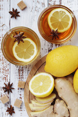 Two glass cups with hot tea with lemon and ginger	