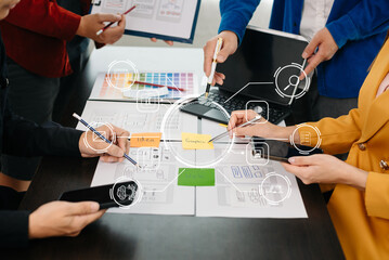  UX developer and ui designer brainstorming about mobile app interface wireframe design with customer breif and color code at modern office...
