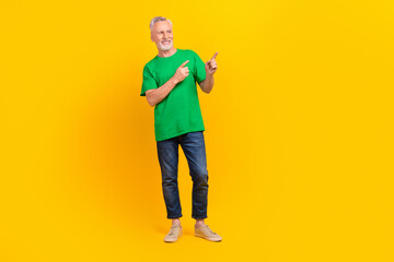 Sticker - Full length photo of cool cheerful aged person look direct fingers empty space proposition isolated on yellow color background