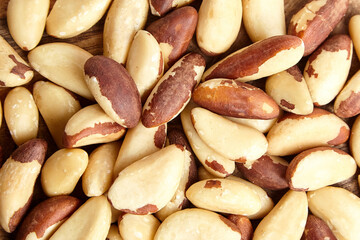 Wall Mural - Brazil nuts texture background closeup. Shelled nuts, top view. Closeup of Brazil nuts nutritious kernel
