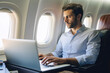© Виктория Марьенко - Modern business travel: the successful man works online on the fly