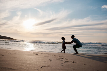 Wall Mural - Child is running to father, beach and silhouette, family with games and love, travel and freedom together outdoor. People, sunset and adventure, man and girl bonding with tropical holiday and nature