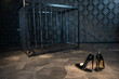 檻のある部屋とハイヒール　フェティッシュなイメージ　high heels placed in a room with a cage