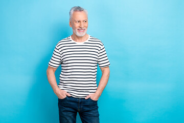 Poster - Photo of dreamy thoughtful man wear striped white t-shirt arms pockets looking empty space isolated blue color background