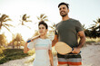 © kleberpicui - Father and son having fun on the beach during summer vacation playing beach tennis