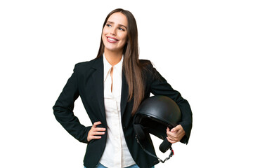 Wall Mural - Young Asian woman with a motorcycle helmet over isolated chroma key background posing with arms at hip and smiling