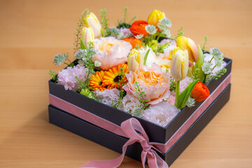 Sticker - Box of different flower on the table