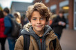 © LiezDesign - Very happy 8 year old boy waiting at the school entrance. ready for back to school.