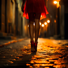 Woman Standing In A Red Light District Wearing A Short Skirt And High Heels On A Cobblestone Street. Concept Of Prostitution And Human Trafficking. 