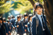 © colnihko - Japanese schoolgirl in uniform and schoolchildren go to school on a sunny day.