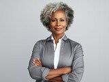 Fototapeta Nowy Jork - Portrait of a Smiling African American Business Woman middle age 50s 40s arms crossed isolated white background