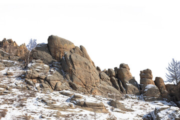 Wall Mural - The rock in a snow-covered steppes isolated on white background