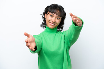 Wall Mural - Young Argentinian woman isolated on white background presenting and inviting to come with hand