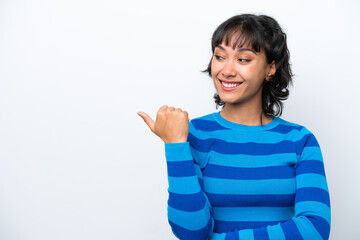 Wall Mural - Young Argentinian woman isolated on white background pointing to the side to present a product