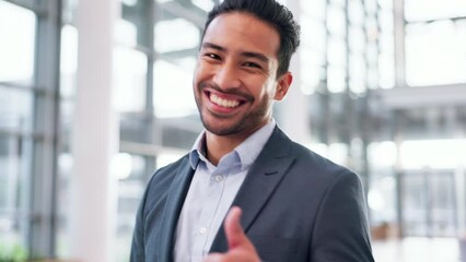 Canvas Print - Thumbs up, wink and a business man walking in the office with a smile for a professional job opportunity. Portrait, mindset or motivation and a happy young corporate employee at work with a yes emoji