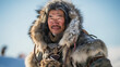 © Marco Attano - Inuit hunter in traditional clothing, ice fishing, stark Arctic landscape, resilience, survival