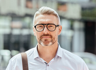 Poster - Mature business man, city and portrait with glasses, bag and ready for walk, travel and outdoor in metro. Entrepreneur, CEO or manager in road, traffic or sidewalk with pride on serious face in Milan