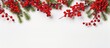 Christmas flatlay with spruce branches red berries and white background Space for text