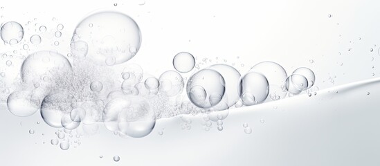 Aufkleber - Foamy texture of a skincare cleanser with soap bubbles on a white background and empty space