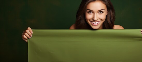 Aufkleber - Smiling girl with green banner over brown background space for text or design