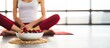 Fit woman enjoying healthy food after fitness exercise Happy young female eating natural granola with cranberries on fitness mat at home