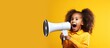 African American girl shouting sharing news with copy space on yellow studio background