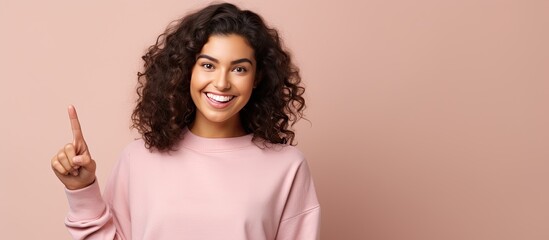 Poster - Happy young woman pointing to blank space content and attractive Space for your idea