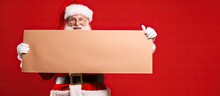 Santa Holding Banner With Blank Space On Red Background
