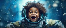 Happy Little Black Boy With A Homemade Rocket Playing Astronaut With White Handmade Stars On A Blue Background Expressing Childhood Creativity And Imag