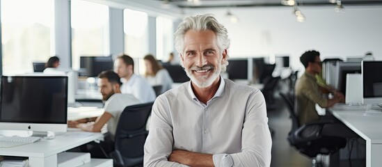 Leinwandbilder - Smiling male software developer at work in office ample space