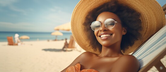 Wall Mural - Smiling black woman in sunglasses enjoying vacation on beach sunbathing with copy space