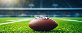 Fototapeta Sport - American football ball on a stadium pitch