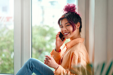 Wall Mural - Asian young woman at home