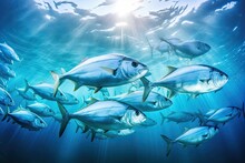 Underwater View Of A School Of Yellowfin Trevally Fish. A Large School Of Trevally In A Deep Blue Tropical Ocean, AI Generated