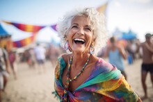Portrait Of Happy Senior Woman Dancing On Beach At Seaside Party