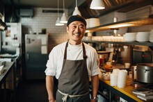 Middle Aged Chinese Chef Working And Preparing Food In A Restaurant Kitchen Smiling Portrait