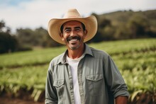 Middle Aged Male Mexican Farmer Smiling And Working On A Farm Field Portrait