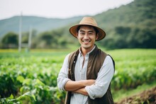 Young Male Chiense Farmer Smiling On A Farm Field Portrait