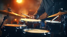 Closeup Photo Of Male Hands Of A Person Playing The Drums With Sticks. Bokeh Lights In The Background.  Playing Music Instrument In The Band Studio. Generative AI