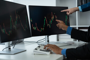 Online stock trading businessman Stock market value trading. Stock broker looking at charts, indices and figures on pc computer screen in office. Trader. Business success concept.