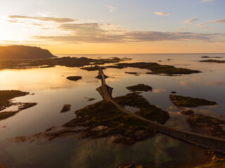 Wall Mural - Fredvang bridges in Lofoten, Norway with a beautiful sunset over the sea. Calm waters, reflections.