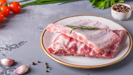 Wall Mural - Raw pork ribs on a plate. Preparation food concept. Top view