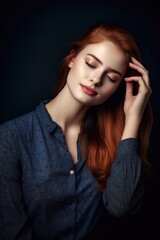 Wall Mural - studio shot of a beautiful young woman with her hand on her head