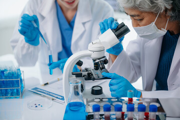 Medical team having a meeting with doctors. Young scientists conducting research investigations in a medical laboratory, a researcher.