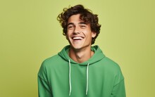 Happy Ultra Young Handsome Man, Who Is Smiling And Laughing, Wearing Bright Clothes. Bright Solid Green Background. Created By Generative AI Technology.