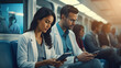 © ZoomTeam - male and female doctor with stethoscopes hidden behind the coat and looking at digital tablet in hospital