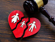 Broken heart and gavel as symbol of divorce and guardianship.