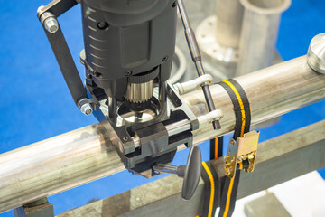 Poster - Drilling machine on pipe. Equipment for pipeline installation. Industrial drilling machine. Process of creating holes in pipeline. Preparation of junction for pipes. Drilling machine on pipeline